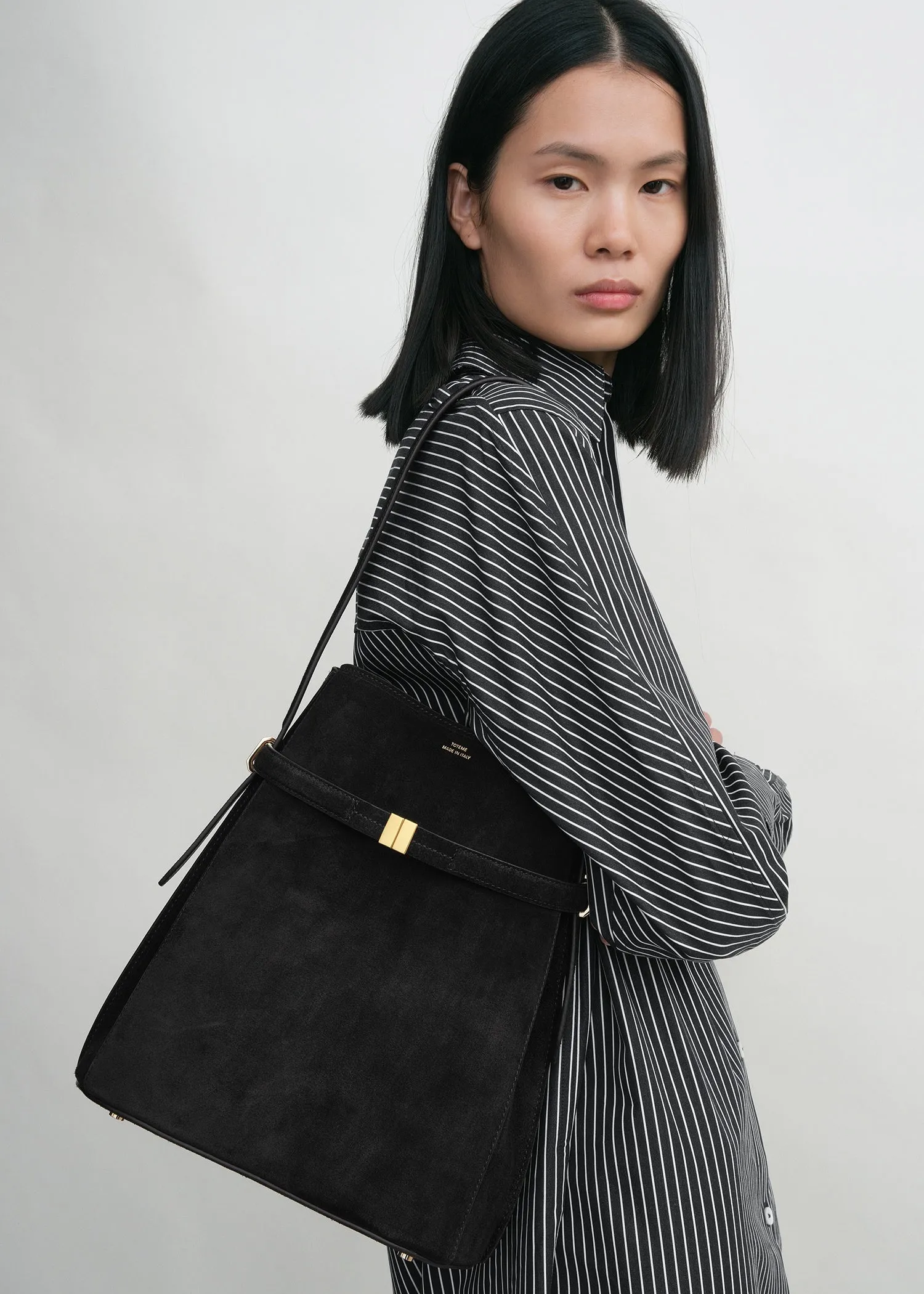 Belted suede bucket bag black